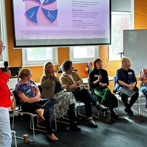 Speaker panel seated at the front of an event
