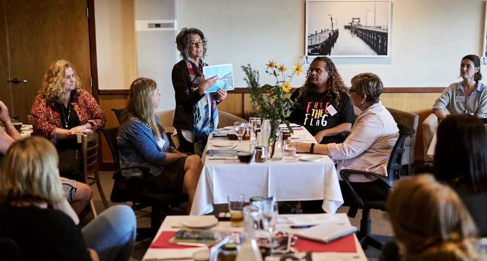 Ceduna/ Far West Our Town team member Sandy Taylor on night one of the retreat, sharing her points of connection with others present and her love of paddle boarding along the Ceduna coast.