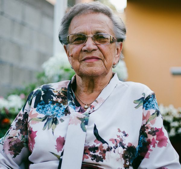 Elderly lady sitting and smiling