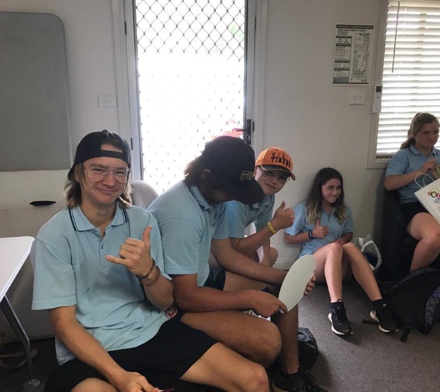 School kids giving a thumbs up