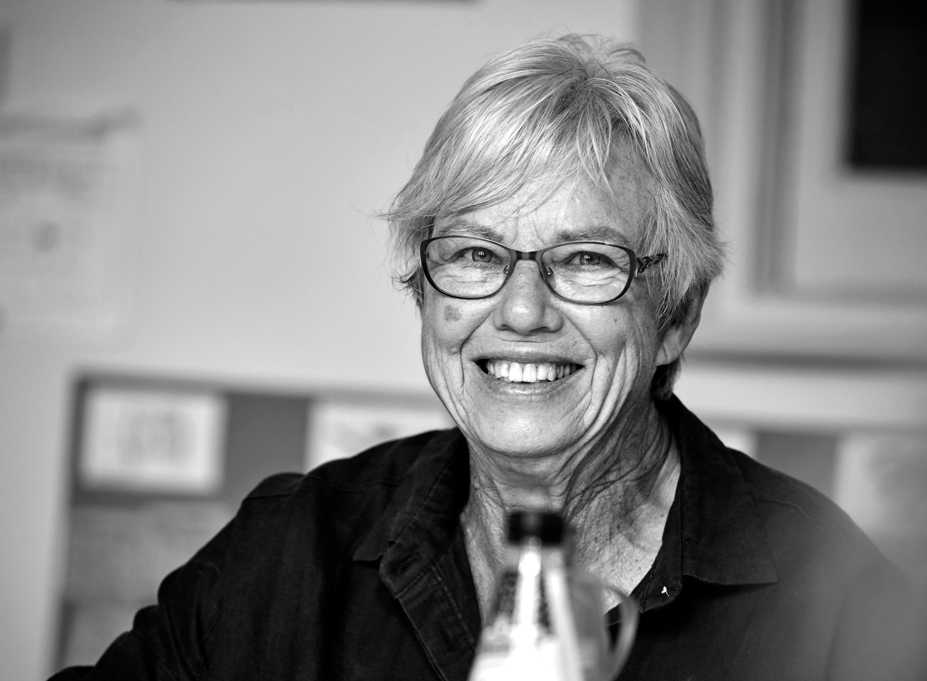 Woman sitting and smiling