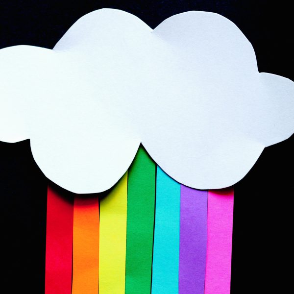 A collage of a rainbow falling out of a cloud