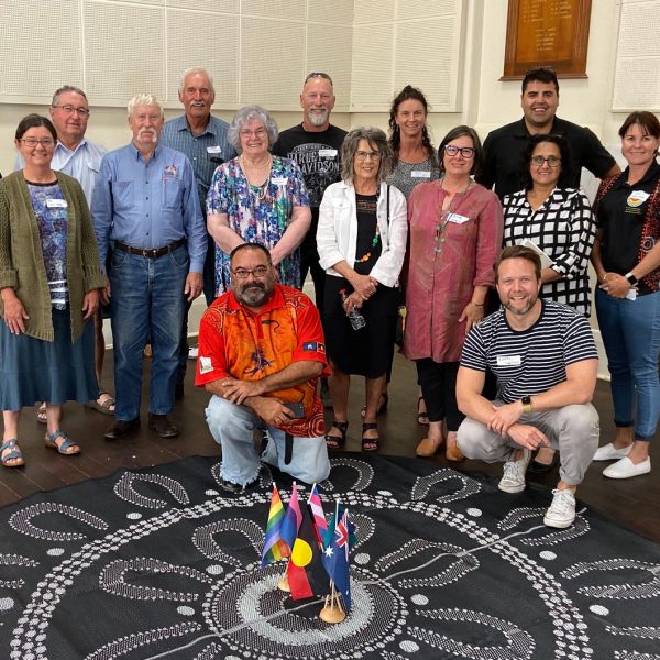 A group of Our Town staff and participants standing together.