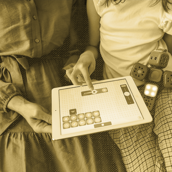 adult and child using an iPad