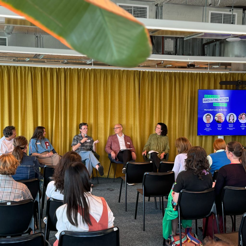 a panel of people talking to an event