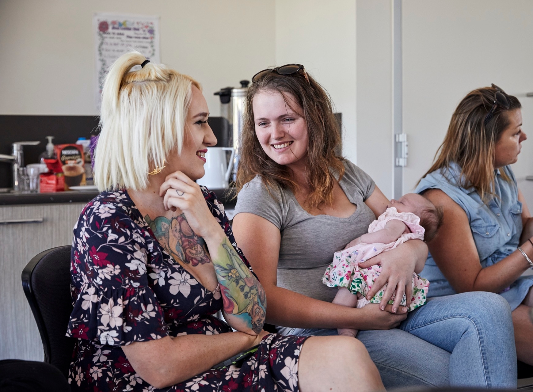 Two mothers sitting and talking