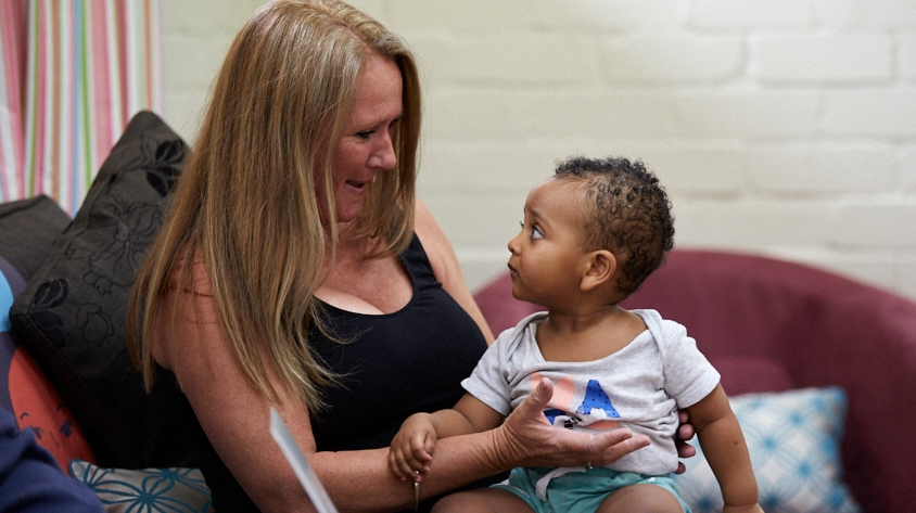 Person holding a child on their lap